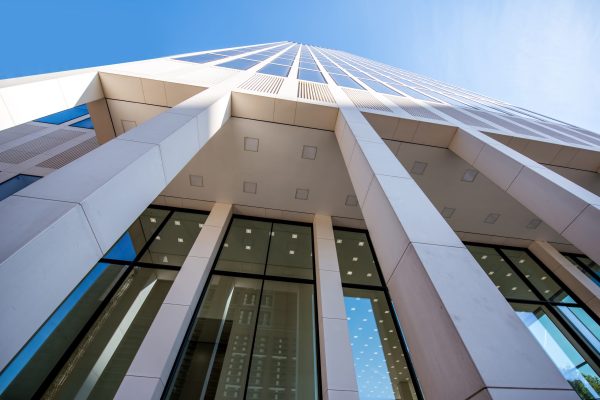View from below on the architectural fragment of the modern tower in Frankfurt city